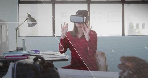 Professional Woman Using VR Headset in Modern Office Environment