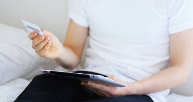 Man Shopping Online with Tablet and Credit Card Indoors - Download Free Stock Images Pikwizard.com