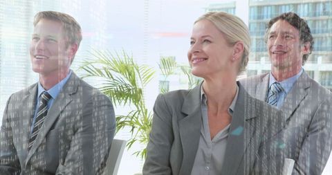 Business Team with Digital Interface Overlay Smiling in Modern Office