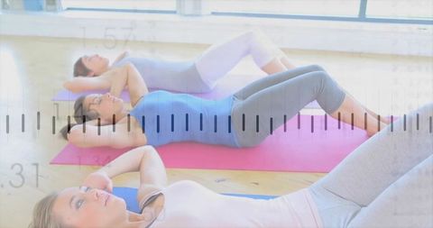 Women exercising crunches strong body fitness class bright mats