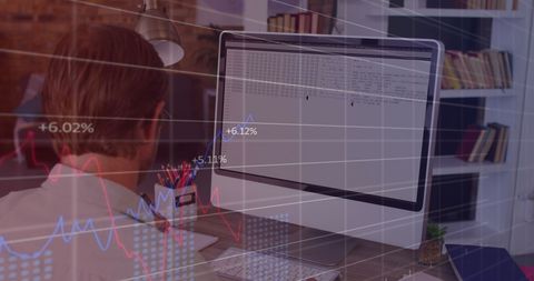 male teacher analyzing data on computer in educational setting - Download Free Stock Images Pikwizard.com