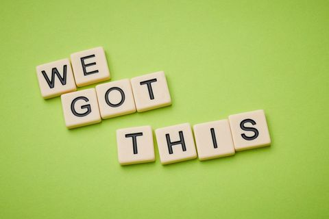 Motivational message with scrabble letters on green background