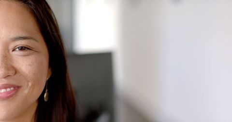 Confident Woman Smiling in Office With Positive Energy