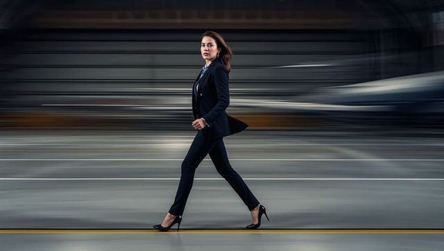 Focused Businesswoman Bridging Modern Industry Horizons