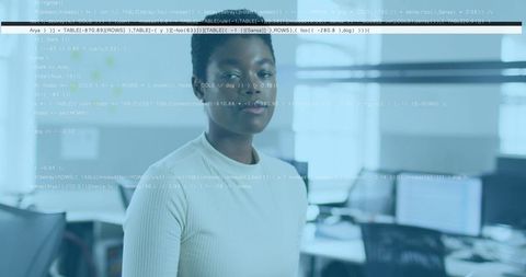 African American Woman in Office with Data Overlay