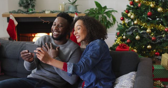 Happy Couple Video Calling with Christmas Tree in Background - Download Free Stock Images Pikwizard.com