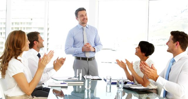 Business meeting with team leader gaining applause - Download Free Stock Images Pikwizard.com