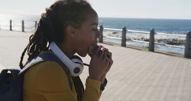 Young Woman Enjoying Ice Cream by Ocean Promenade - Download Free Stock Images Pikwizard.com