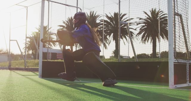 Field Hockey Goalkeeper Blocking Shot During Sunset - Download Free Stock Images Pikwizard.com