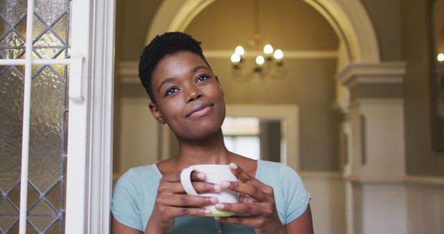 Contemplative Woman Holding Coffee Mug in Cozy Home Interior - Download Free Stock Images Pikwizard.com