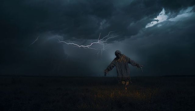 Ominous Scarecrow in Lightning Storm with Moody Atmosphere