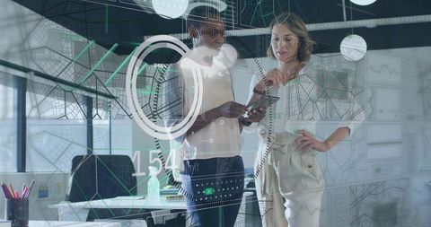 Businesswomen Collaborating on Augmented Reality Analytics Display on Glass Wall