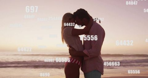 Couple touching foreheads standing in surf at sunset embracing with numeric overlay