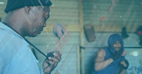 Boxer Training with Coach and Digital Data Overlay