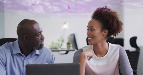 African american business professionals collaborating at office desk