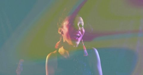 Vibrant Concert Performance With Colored Lights and Stage Effects