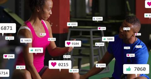 Personal trainer coaching female client during functional workout with social media likes