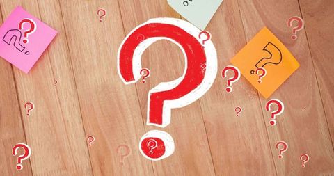 Bold red question mark on wooden desk with colorful sticky notes for ideas