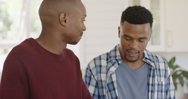 Close Friendship of Two Men Chatting Indoors in Bright Room - Download Free Stock Images Pikwizard.com