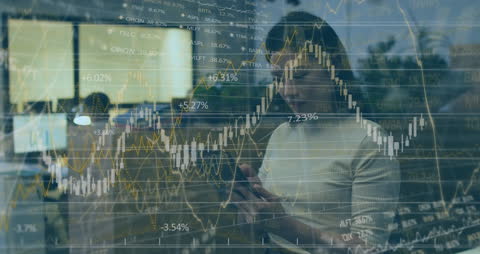 Businesswoman Analyzing Data with Financial Graphs Overlay