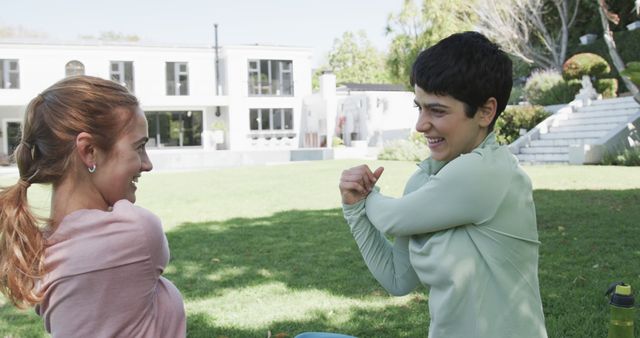 Two Women Stretching in Sunny Park - Download Free Stock Images Pikwizard.com