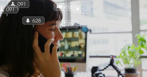 Smiling Woman on Smartphone at Work with Digital Alerts Overlay