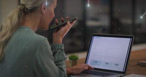 Professional Woman Using Technology to Analyze Business Growth