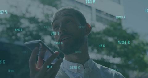 Businessman Talking on Smartphone with Digital Financial Data Overlay