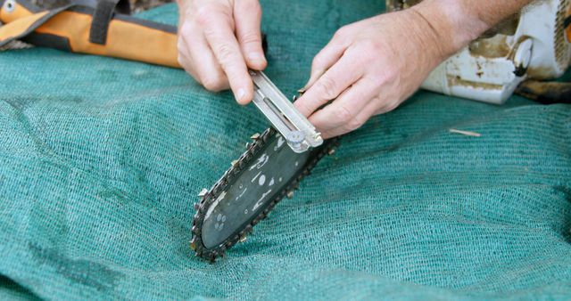 Close-Up Sharpening Chainsaw Blade for Outdoor Maintenance - Download Free Stock Images Pikwizard.com