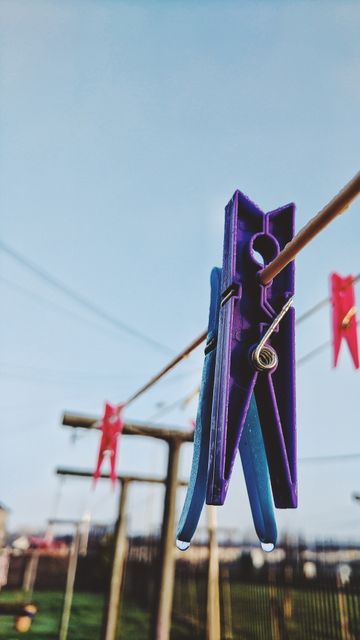 Close Up of Colorful Clothespins on Clothesline Outdoors - Download Free Stock Images Pikwizard.com