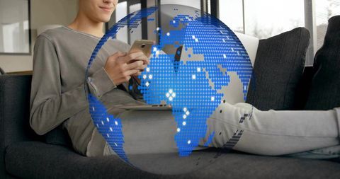 Casually Dressed Man Connecting Globally with Smartphone Overlay