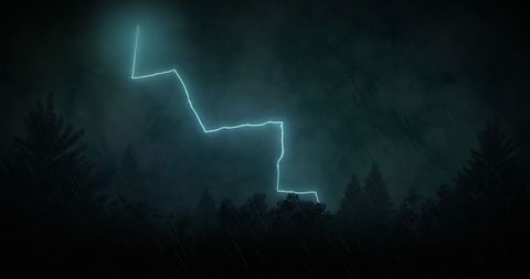 Dramatic Lightning Bolt Illuminates Stormy Night Over Forest
