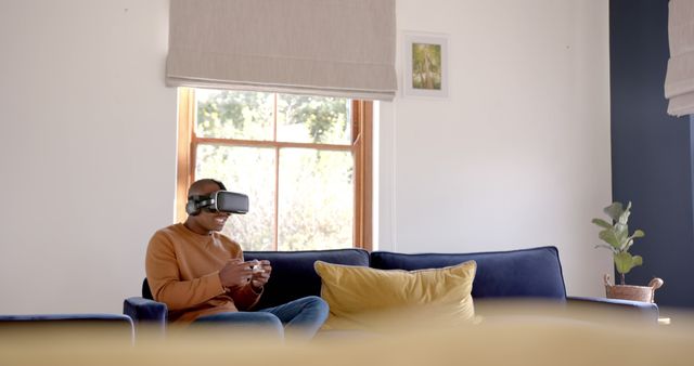 Man Enjoying Virtual Reality Gaming in Modern Home Living Room - Download Free Stock Images Pikwizard.com