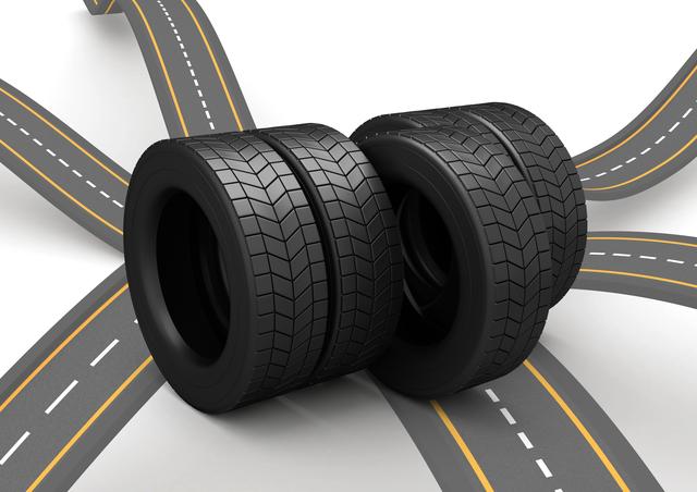 Brand new tires are placed at an intersection, highlighting their grip and tread. This image is useful for automotive advertisements, car maintenance promotions, transportation concepts, or tire manufacturing marketing. It visually represents safety, reliability, and journey.