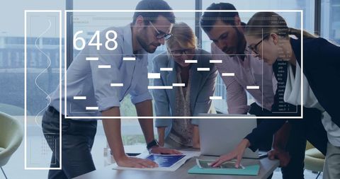 Business Team Collaborating on Financial Data with Digital Interface