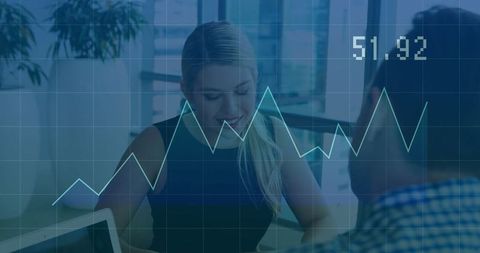 Businesswoman Analyzing Data With Digital Chart Overlay in Modern Office