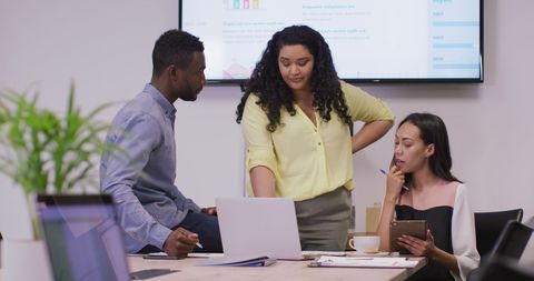 Diverse Team Collaborating in a Modern Office Environment