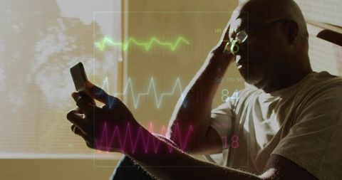 Senior man checking biometric vitals on smartphone with ecg and spo2 overlays at home