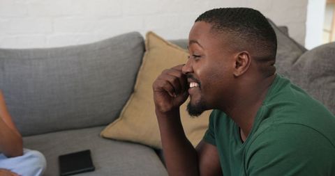 Man Pretending to Call, Relaxing on Sofa in Comfortable Living Room