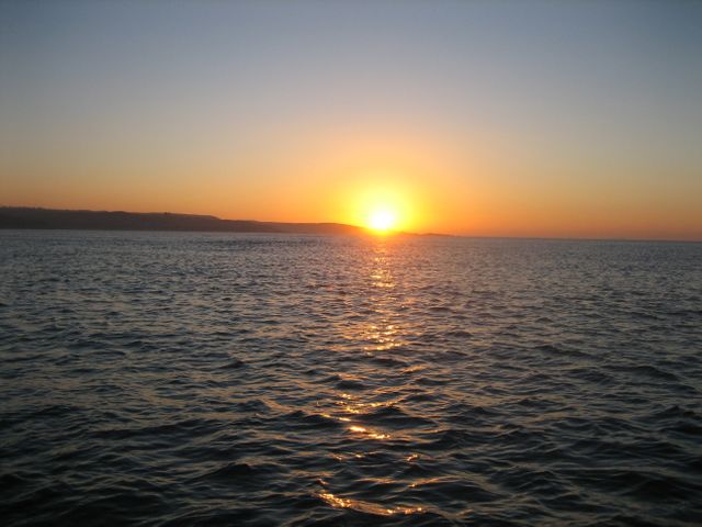 Stunning Sunset Over Calm Ocean Waters - Download Free Stock Photos Pikwizard.com