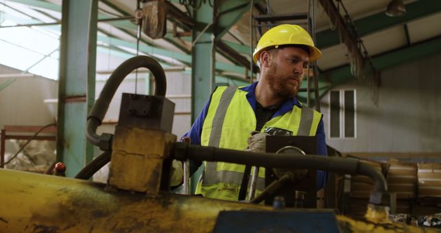 Industrial Worker Wearing Safety Gear Operating Heavy Machinery - Download Free Stock Images Pikwizard.com