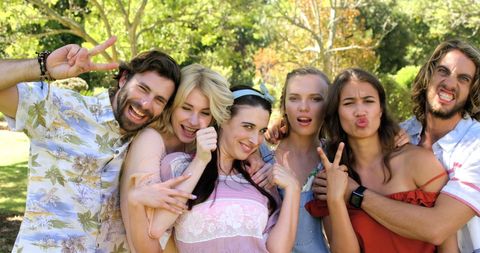 Carefree Friends Posing Happily in Sunlit Park - Download Free Stock Images Pikwizard.com
