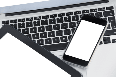 Technology setup featuring open laptop with blank-screen devices is a modern and clean depiction ideal for illustrating concepts of connectivity, digital communication, or remote workspaces. Useful for technology marketing, blog visuals about multitasking, or presentation slides emphasizing tech integration.