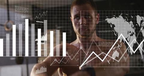 Mid-adult man viewing augmented fitness analytics dashboard with wrist tracker at gym