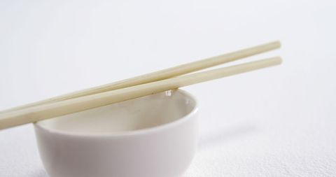 Minimalist Arrangement of Chopsticks on White Bowl - Download Free Stock Images Pikwizard.com