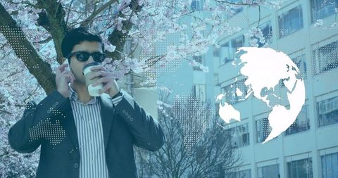 Confident Businessman Networking Amidst Global Graphic Background