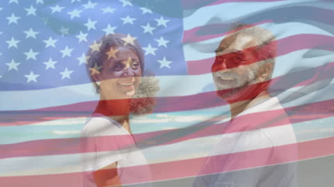 Smiling Senior Couple at Beach with Overlay of American Flag