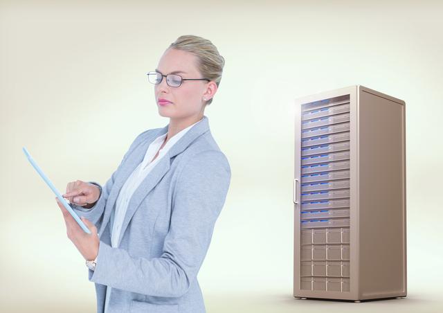Businesswoman standing in a corporate environment beside a server rack using a digital tablet, illustrating technology and information management or IT. Ideal for use in business, technology, IT, and corporate-related projects and advertisements.
