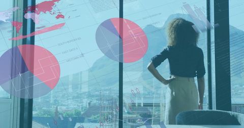 African American Businesswoman Analyzing Financial Graphs in Modern Office