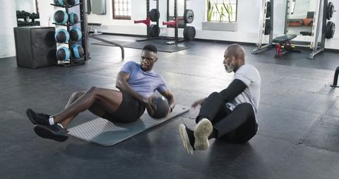 Strong core training with medicine ball in gym fitness routine